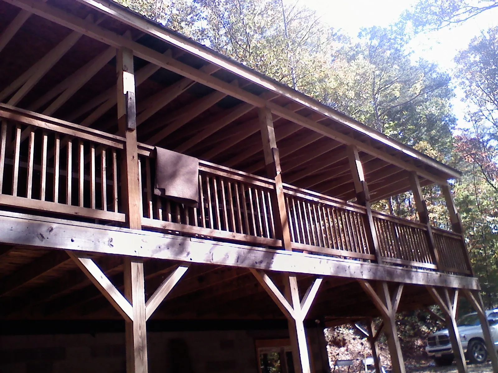 Timber framing under a new elevated porch and deck — Roof Leak Repair in Sandy Ridge by Roofing Brothers